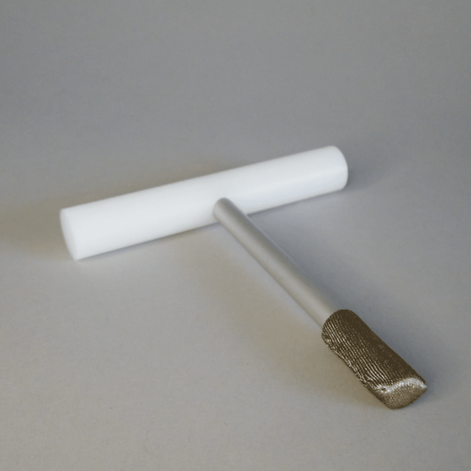 Image of a T-grip stylus with ergonomic design for improved control and usability