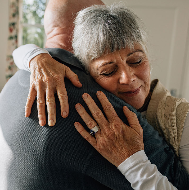 A couple in a warm and supporting embrace