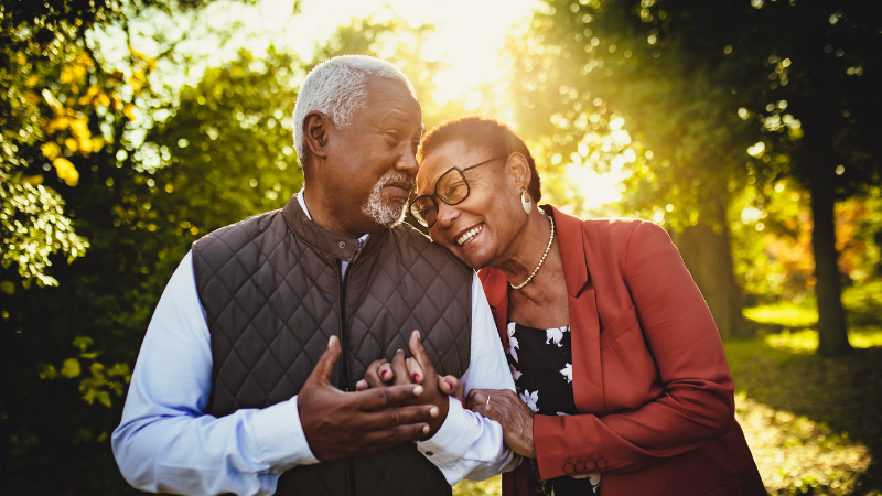 senior couple walking on sunny day