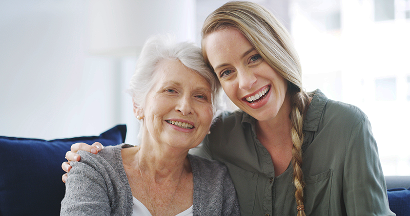 Mother and daughter smiling